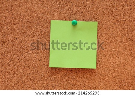 Blank paper note on corkboard (bulletin board).