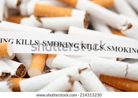 Stop Smoking! Broken cigarettes and warning message \