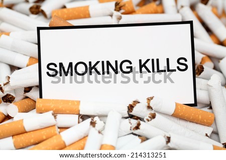 Stop Smoking! Broken cigarettes and warning message \