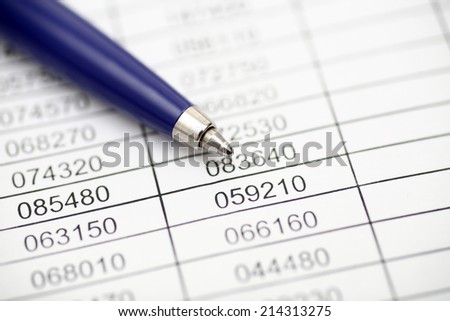 Financial statements. Ballpoint pen on financial statements. Closeup.
