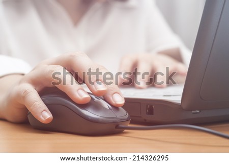 Young businesswomanwoman working on the laptop in morning