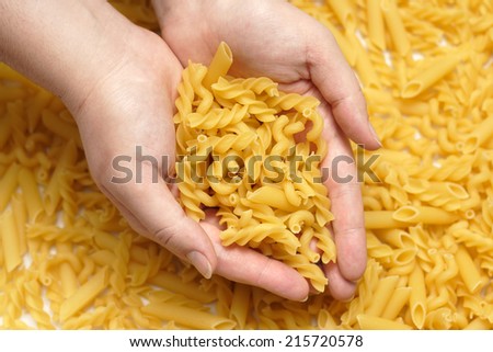 Pasta in hands.