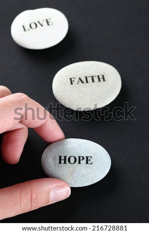 Hope, Faith and Love stones. One of the stones with the word \