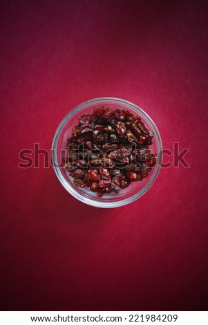 Dried barberry in a glass bowl.
