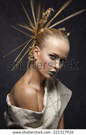 Mystic portrait of a girl with ears in her hair and the Belarusian national pattern  and towel