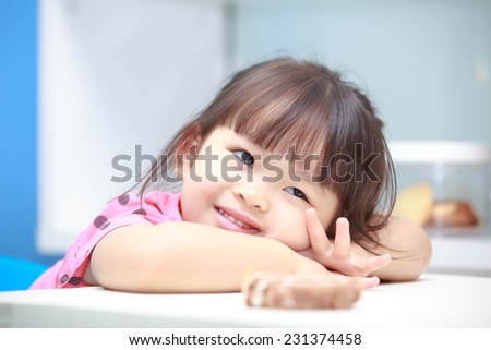 Asian girl sitting smiling happily acted ideally.
