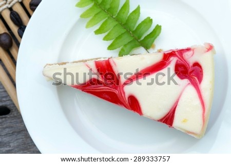Strawberry cheese cake  in white dish on the wood table