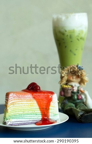 Rainbow crepe cake with green tea.Natural light in the cafe