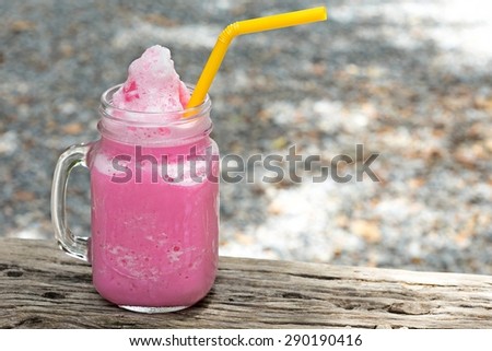 strawberry milk shake on wood table