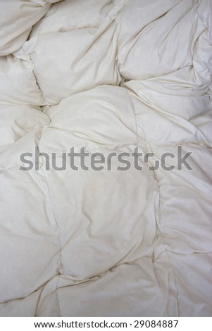 white bed linen in vertical