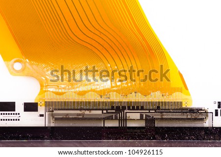 Detail of flexed printed circuit board (FPC) connected to LCD isolated on white
