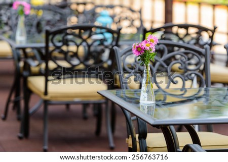 quiet cafe with vintage flowers on the table