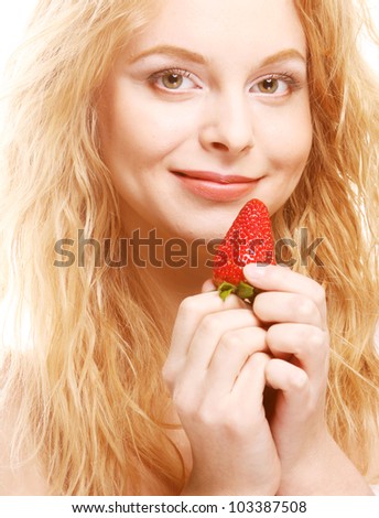 Young beautiful happy smiling woman with strawberry