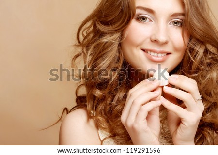 Beautiful woman eating candy