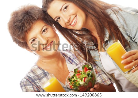 two women with juice and salad