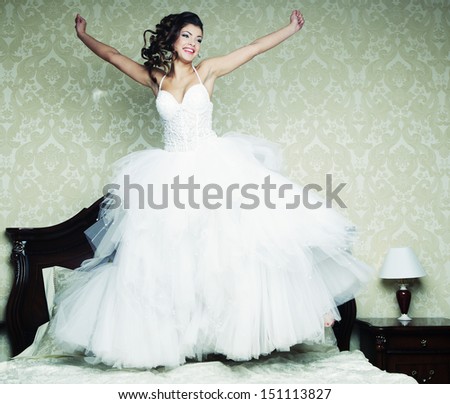 happy bride jump on bed.
