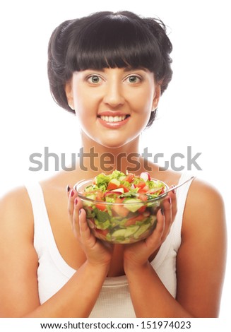 Young funny woman eating salad