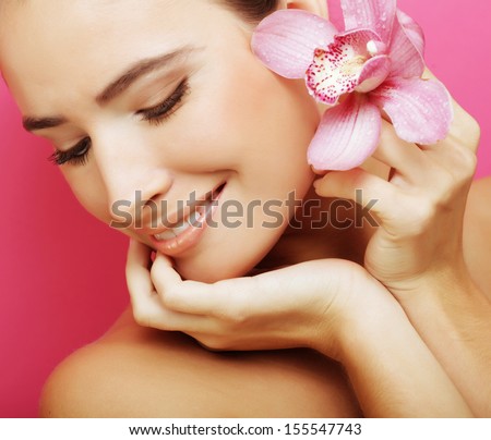 happy woman with orchid flower