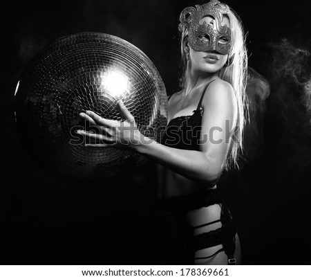lady in mask with disco ball