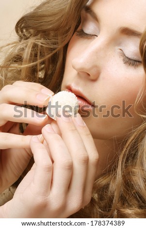 woman eating candy