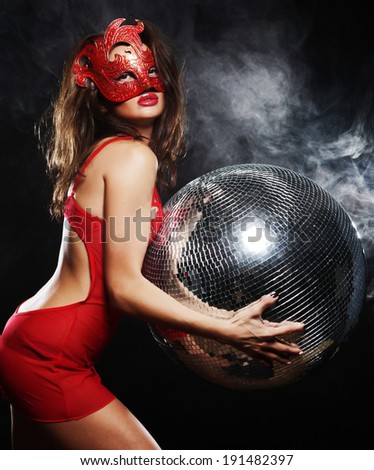 lady in red mask with disco ball