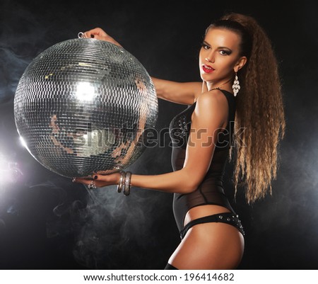 dancer girl in smoke with disco ball, night club