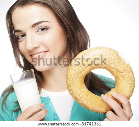 happy woman with milk and donut