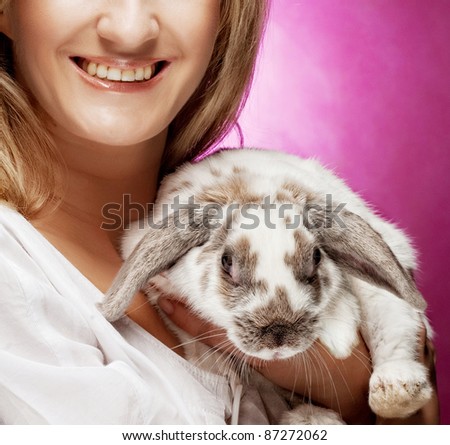 close up portrait girl holding rabbit on hand