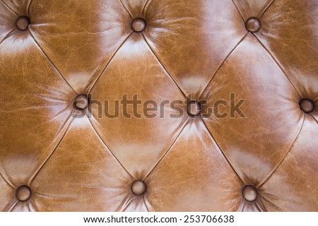 brown diamonds texture of aged leather sofa, background in shabby chic style