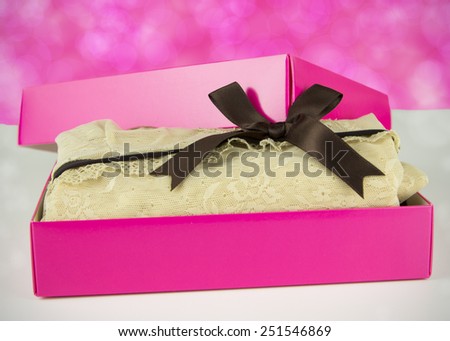 pink present with nice vintage lingerie for her on the pink background