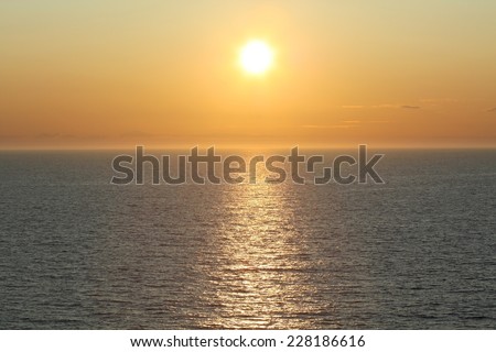 Midnight sun creating lens flare in the arctic circle, Norwegian Sea, Norway