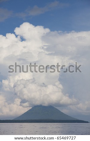Pulau Manado Tua with clouds as seen from a dive boat in North Sulawesi, Indonesia.