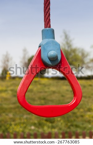 Red ring at a playground for young kids to play or a challenge for business corporate employees.