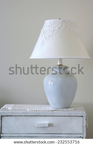Lamp on wood background dresser - vintage effect style