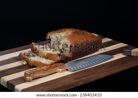 Isolated freshly baked and sliced banana bread with blueberries added