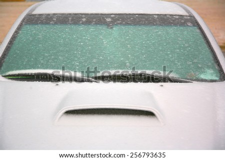 Car covered in ice and frozen from ice storm