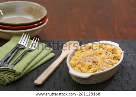 Ready to serve mac and cheese dinner table forks and napkins