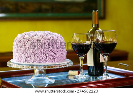 Round chocolate cake individual slice with wine