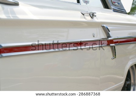 COLUMBUS, OHIO - CIRCA June 2015: Vintage white 1964 Ford Fairlane door, logo, color strip on display the Davis-Shai Car and Vendor Show