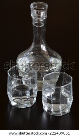 glass carafe with water and two glasses