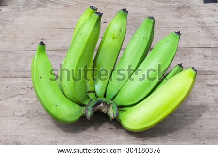 Bananas fruits heap on wood background