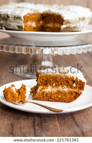 eat a piece of honey sponge cake with cream on a wooden board