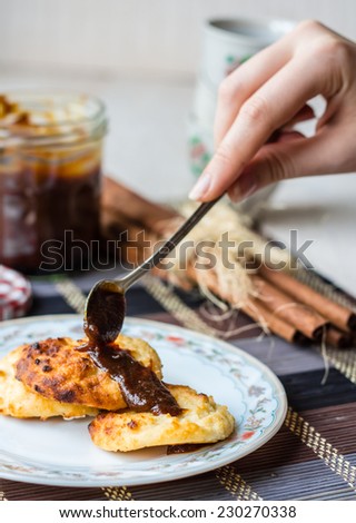 cottage cheese pancakes with condensed milk and coffee, breakfast on a white board