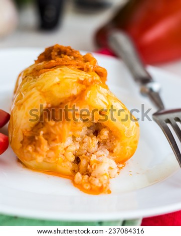 stewed peppers with meat and rice in tomato sauce,dinner,on a white background