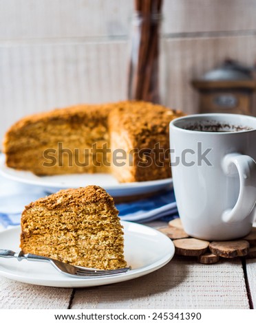 a piece of honey cake with sour cream and nuts,Slavic cuisine