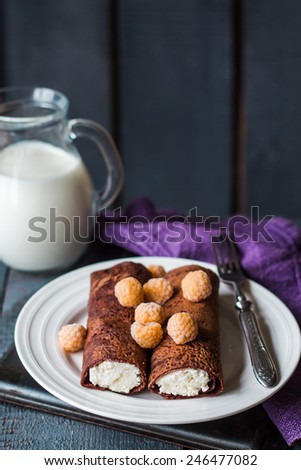 chocolate pancakes with cottage cheese and condensed milk with berries, dessert ,Maslenitsa