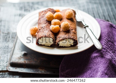 chocolate pancakes with cottage cheese and condensed milk with berries, dessert ,Maslenitsa