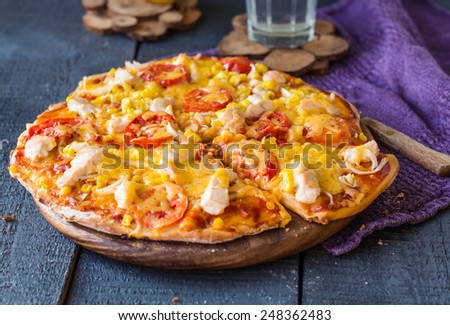 juicy slices of pizza with chicken, corn, tomatoes and double cheese, lunch