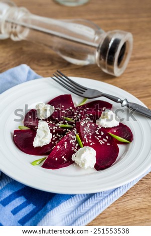 beet salad with goat cheese, garlic and sesame seeds, light dinner