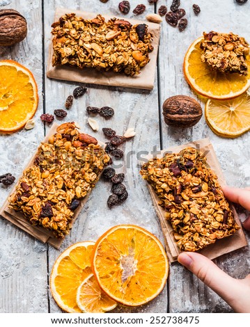 granola bars citrus, peanut butter and dried fruit, Healthy eating concept with cereal bar